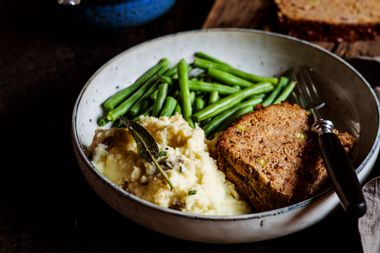 Plate of mashed potatoes with green beans and meat loaf