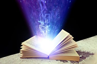 Abstract photo of a open book with light and letters
