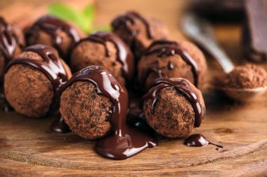 Chocolate candy truffles glazed with chocolate ganache
