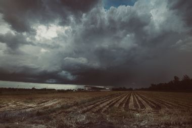 Storm Cloud Over A Farm