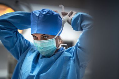 Surgeon wearing a medical mask