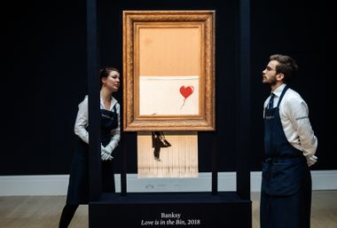 Image for Banksy put up a $600,000 stop sign. Two men with bolt cutters took it down 