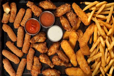 Mozzarella sticks, chicken wings, french fries and chicken fingers