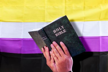 A Bible And A Nonbinary Flag