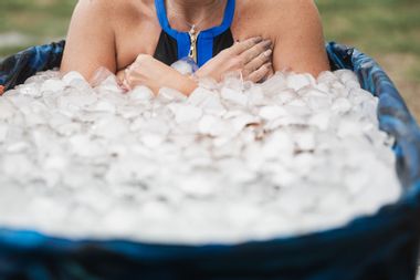 Woman with her arms folded in the cold in an ice bath