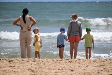 Parents and children at beach