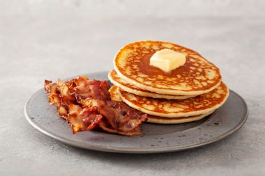 Sweet pancakes with butter and bacon