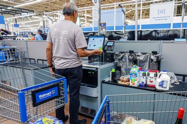 Walmart customer using Self Checkout