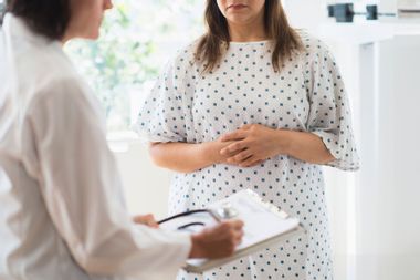 woman; doctor; check up; weight; nervous