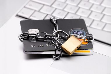 Credit cards chained up with padlock