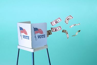 Dollar bills floating out of a voting booth