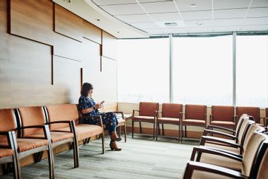 Woman waiting in medical office waiting room