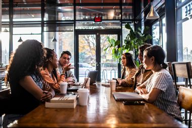Young professionals collaborating in coffeeshop
