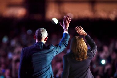 Barack Obama and Kamala Harris waving