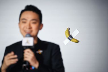 Comedian banana taped to wall artwork