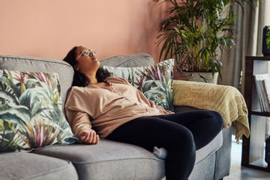 Woman resting on a sofa