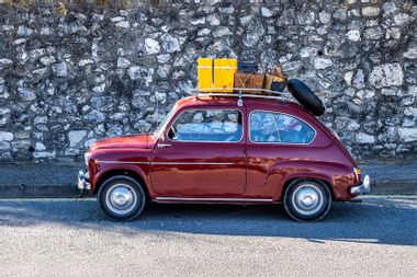 Old car loaded with suitcases