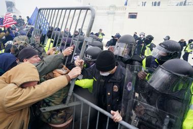 Police hold back protesters January 6 Capitol Riot