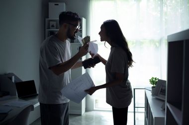 Couple fighting about finances money bills