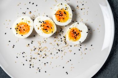 Halved hard-boiled eggs on a plate