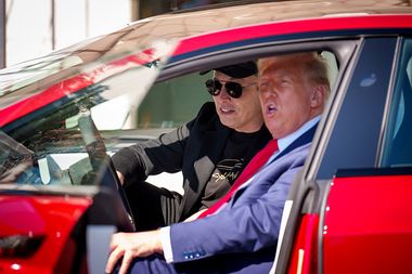 Elon Musk and Donald Trump in a Tesla car