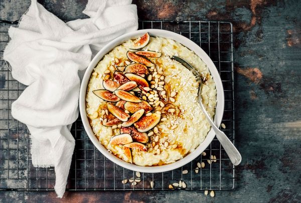 Rice pudding with pine nuts, fresh figs and maple syrup