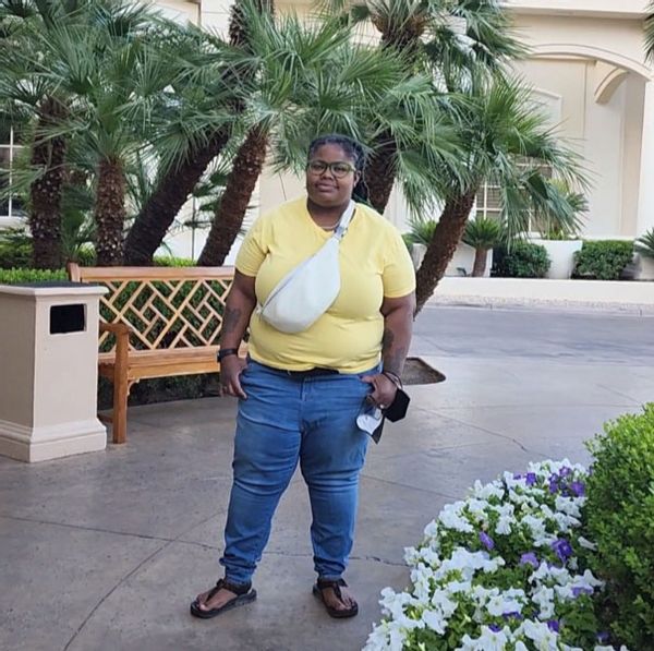 Jodyann Morgan in front of the Four Seasons