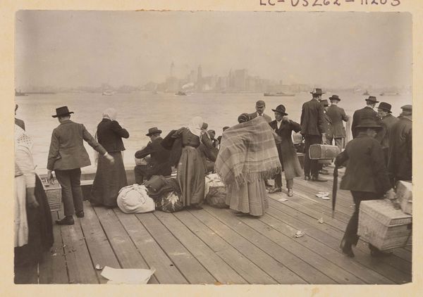 Immigrants waiting to be transferred, Ellis Island, October 30, 1912.