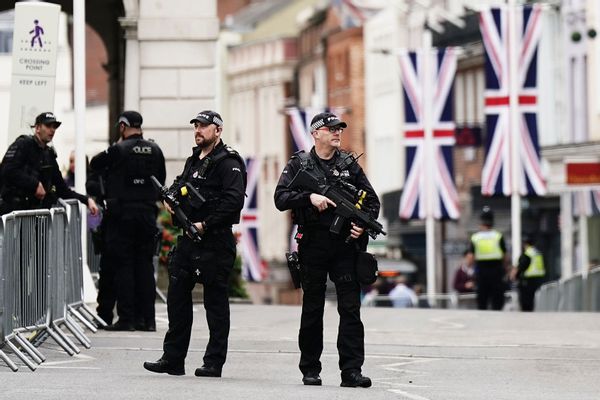 Armed police patrol before the Committal Service for Queen Elizabeth II 