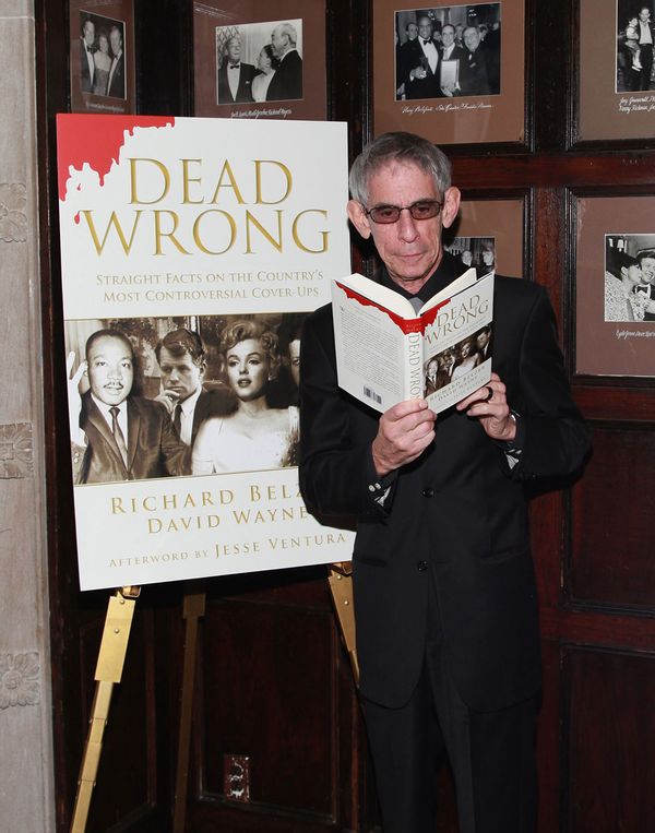 Actor, comedian and author Richard Belzer poses with a copy of the book 'Dead Wrong: Straight Facts On The Country's Most Controversial Cover-Ups'