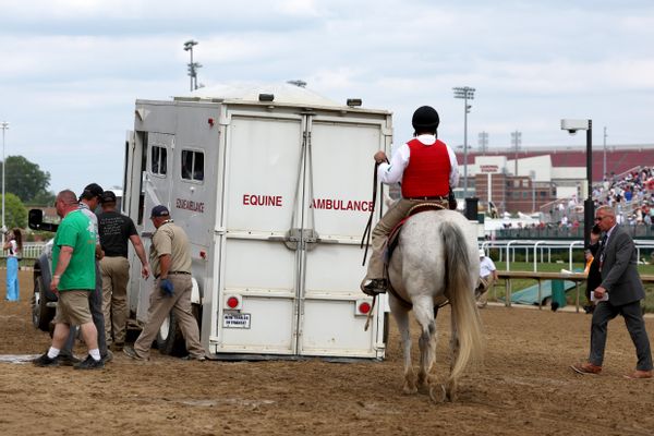 An equine ambulance carrying race horse Here Mi Song is driven off the track after racing in the tenth race ahead of the 149th Kentucky Derby at Churchill Downs on May 06, 2023 in Louisville, Kentucky.