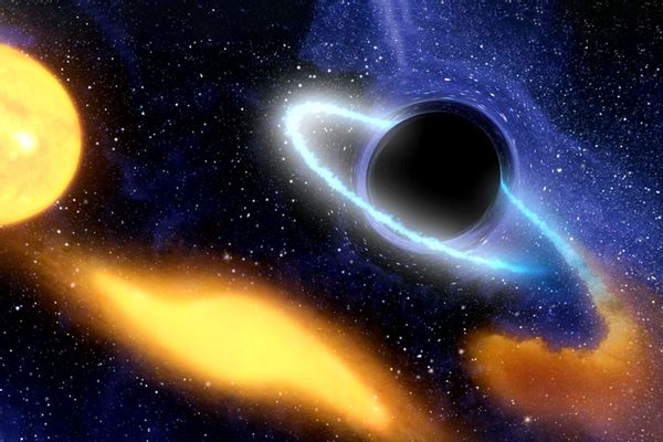 An illustration of a supermassive black hole at the center of a galaxy