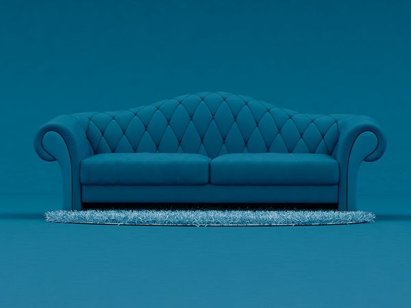 Blue sofa with light blue rug