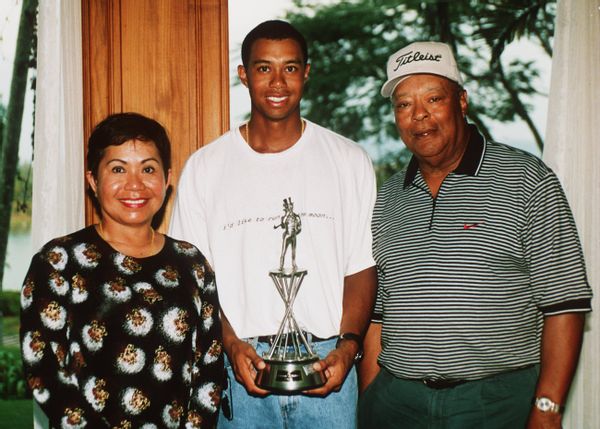 Tiger Woods with his parents Kultida and Earl Woods