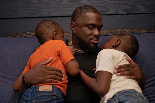 Hope and his two sons outside their home in Houston