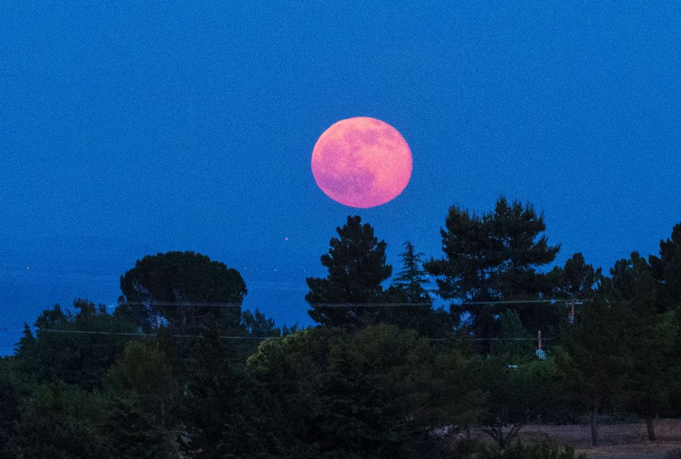 A stunning "Strawberry Moon" will rise Thursday. Here's what that means