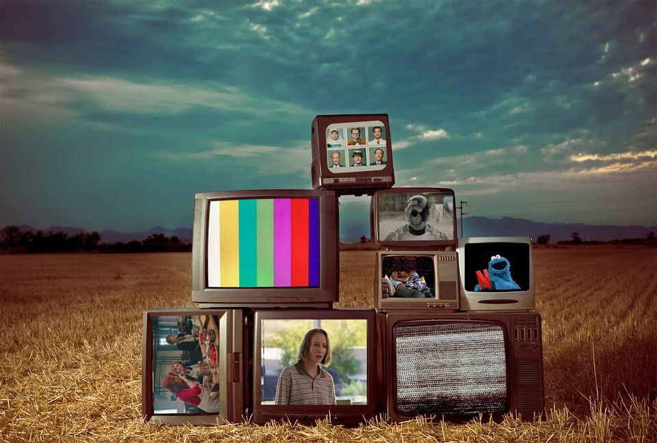 Various old television sets playing modern shows and movies